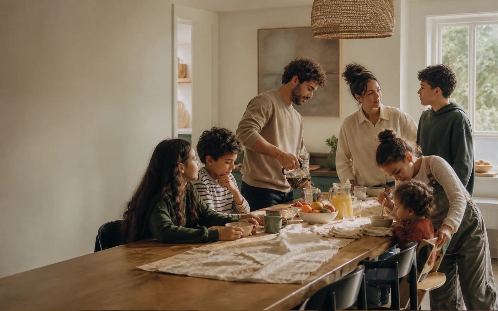 A household of seven sharing an ordinary weekend breakfast